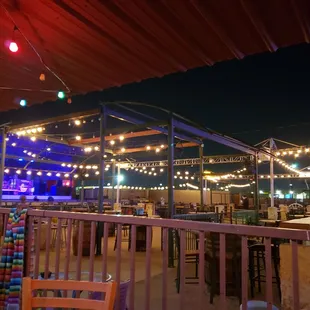 a view of a patio area at night