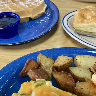 Veggie omelette with home fries and biscuit and gravy and original waffle