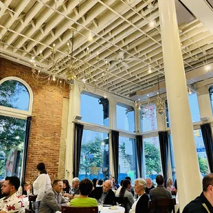 a large group of people sitting at tables