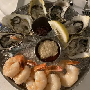 a platter of oysters and shrimp