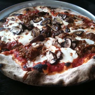 Sausage pizza with crimini mushrooms