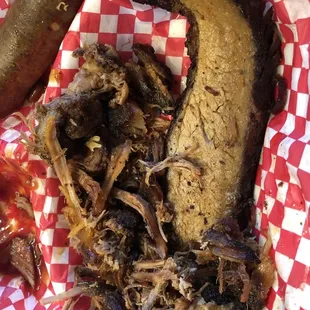 a pulled pork sandwich and a pickle