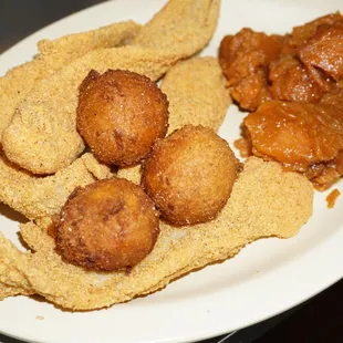 Fried catfish with homemade hush puppies and yam
