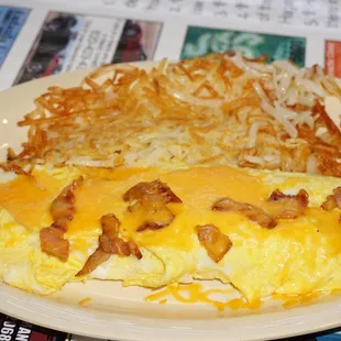 Bacon and cheese omelette with crispy hash browns