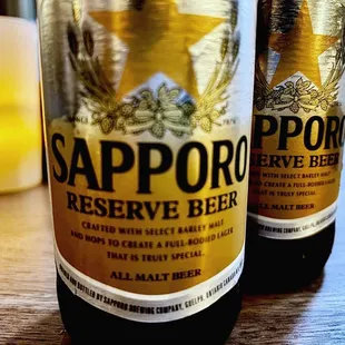 two bottles of sappor reserve beer