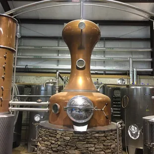 a copper pot still in use