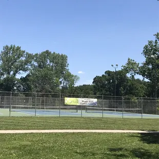 Only one of the many tennis courts complete with bleachers to watch and public restrooms