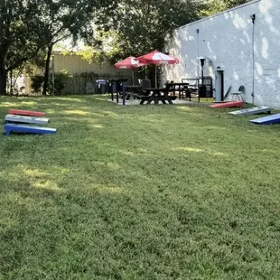Cornhole and horseshoes are available to play in the side yard with outdoor seatings.