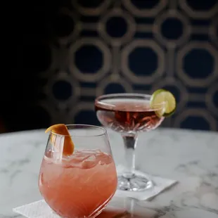 two cocktails on a table