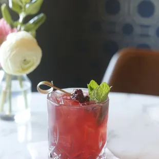a glass filled with a drink