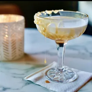 a cocktail in a coupe glass