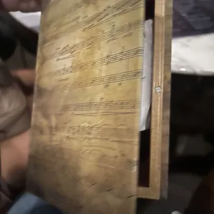 Looked like a book but has handwritten notes from patrons on napkins inside :)