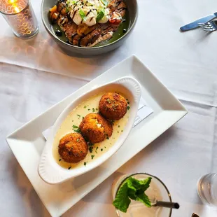 Arnachini and burrata on fried green tomatoes