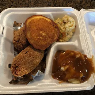 Salmon croquettes with mashed potatoes and gravy and broccoli &amp; rice casserole.