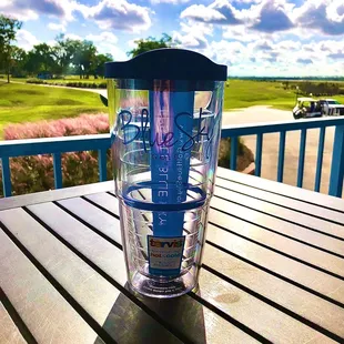 a glass of water on a wooden table