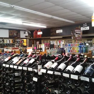 rows of wine bottles in a store