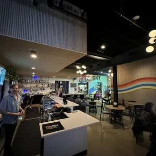 a man standing at a bar