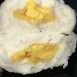 a person holding a piece of food