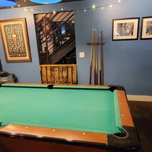 a pool table in a blue room