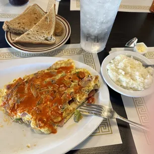 Country omelette, grits, and whole wheat toast.