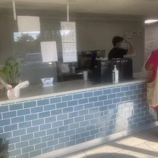 a woman standing at the counter