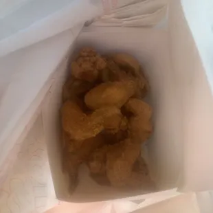 chicken nuggies in a paper bag
