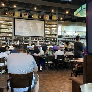 Window seating looking at the fish tank and bar.