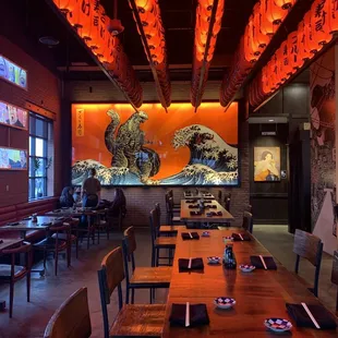 a restaurant with a long table and chairs