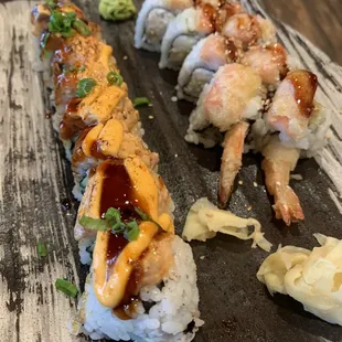 a sushi roll with shrimp and sauce