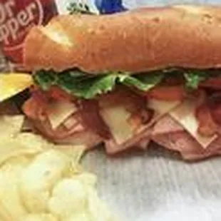 a sub sandwich and chips