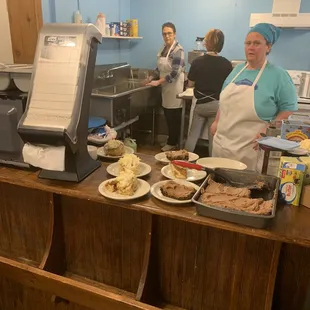 a group of people in a kitchen