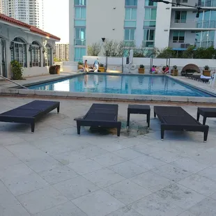 a pool and lounge chairs