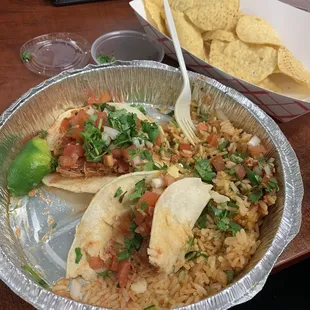 a plate of tacos and chips