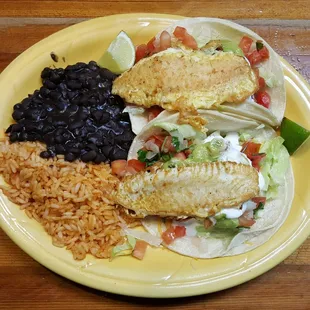 Grilled tilapia taco plate with rice and beans