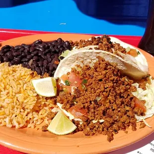 Taco platter with chorizo, black beans and rice.