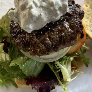 LAMB BURGER, TOPPED WITH FRESH TOMATO, ONION, FETA CHEESE,Tzatziki SAUCE, ON A CIABATTA BUN TOASTED IN GARLIC OIL