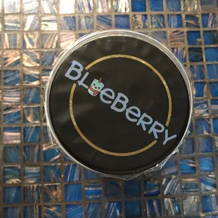 a close up of a blueberry logo
