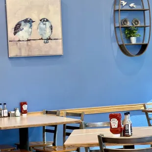 two birds perched on a branch