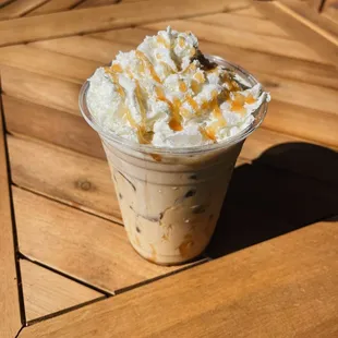 Beat the heat with our café frappe--icy, creamy, and topped with a swirl of whipped cream.