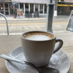 a cup of coffee on a saucer