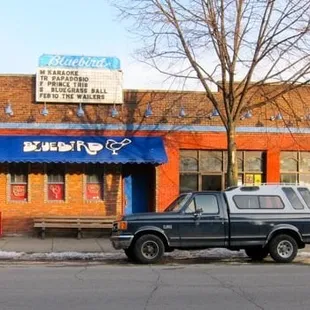 a pickup truck parked in front of it