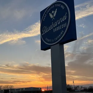 a bluebonnet bbq sign at sunset