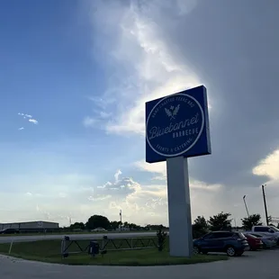 a bluebonnet bbq sign in a parking lot
