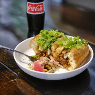 Check out our brand-new Banh Mi sandwich! Slow roasted local pork on a fresh baguette topped with tasty pickled veg.