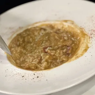 a bowl of soup with a spoon in it