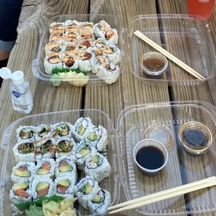sushi and chopsticks on a picnic table