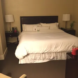 a bed with a white comforter