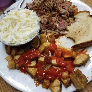 Pulled pork, fried potatoes, cole slaw and Texas toast.