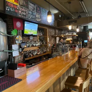a woman sitting at the bar