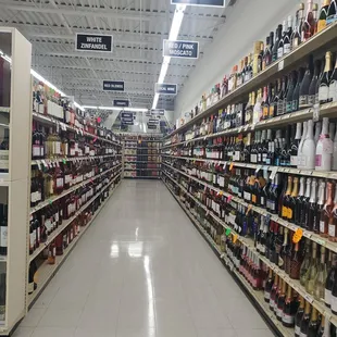 a wide aisle of liquor